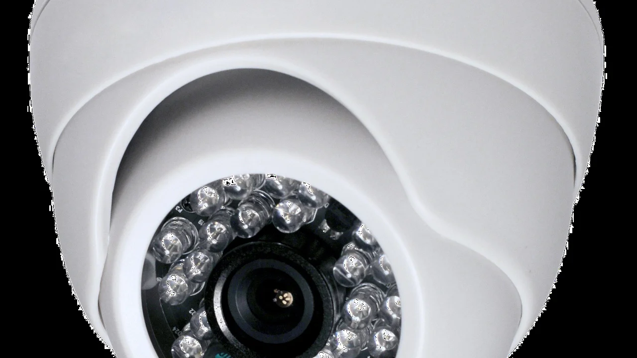 Close up on a plate of mashed potatoes, topped with baked pork chops with cream of mushroom soup, and a side of green beans.