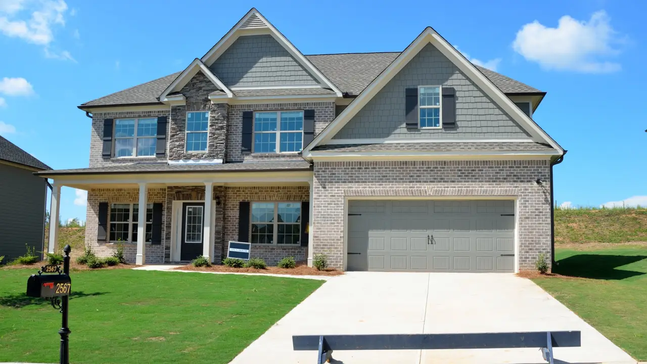 overhead view of corned beef sliced and on a platter with cabbage, potatoes, and carrots
