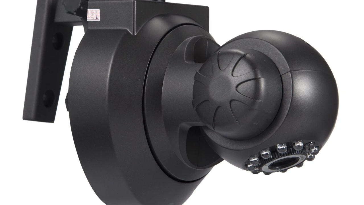 Close up on a plate of mashed potatoes, topped with baked pork chops with cream of mushroom soup, and a side of green beans.